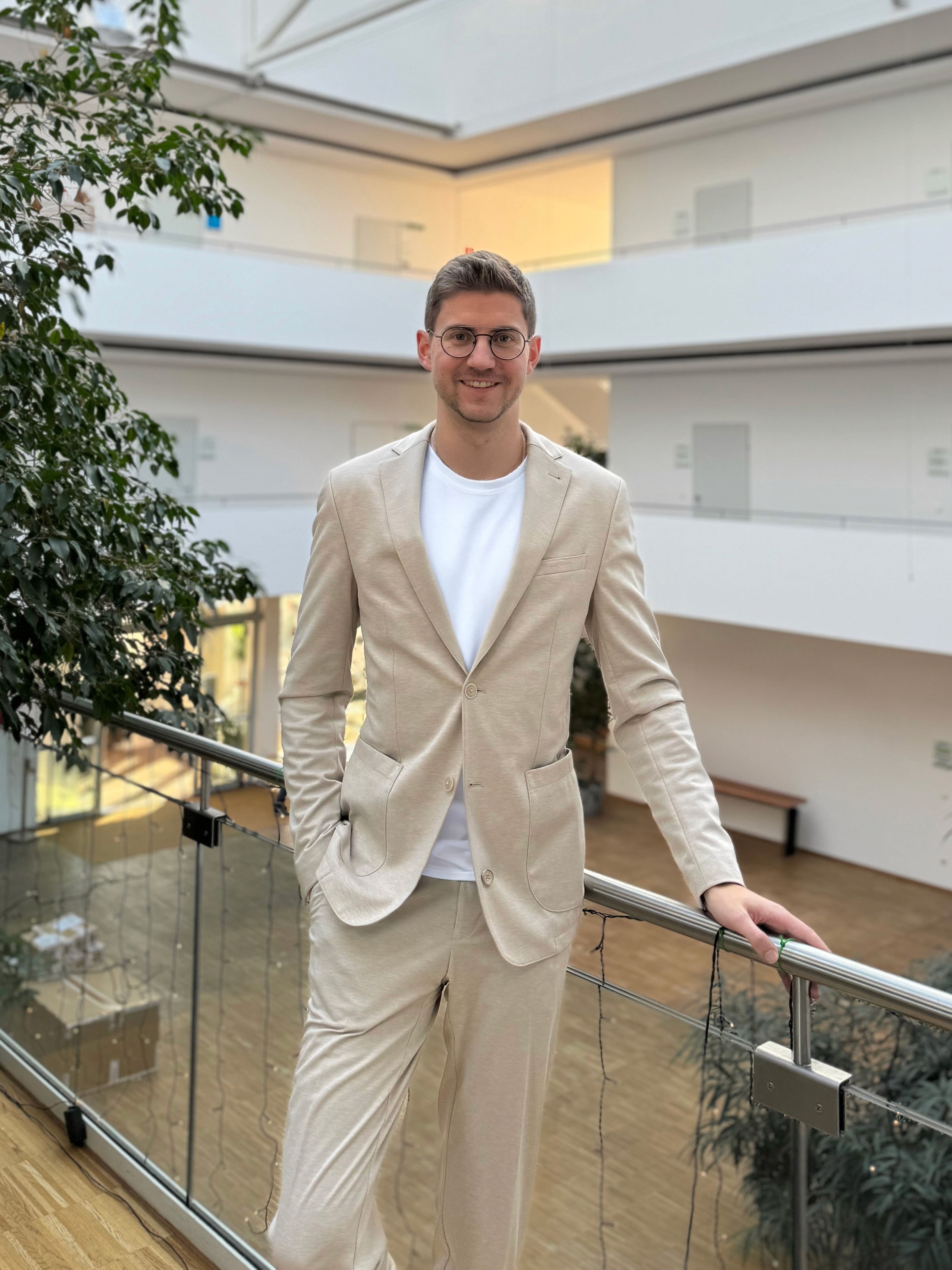 Closeup of woman wearing gold sweater typing on MacBook Pro