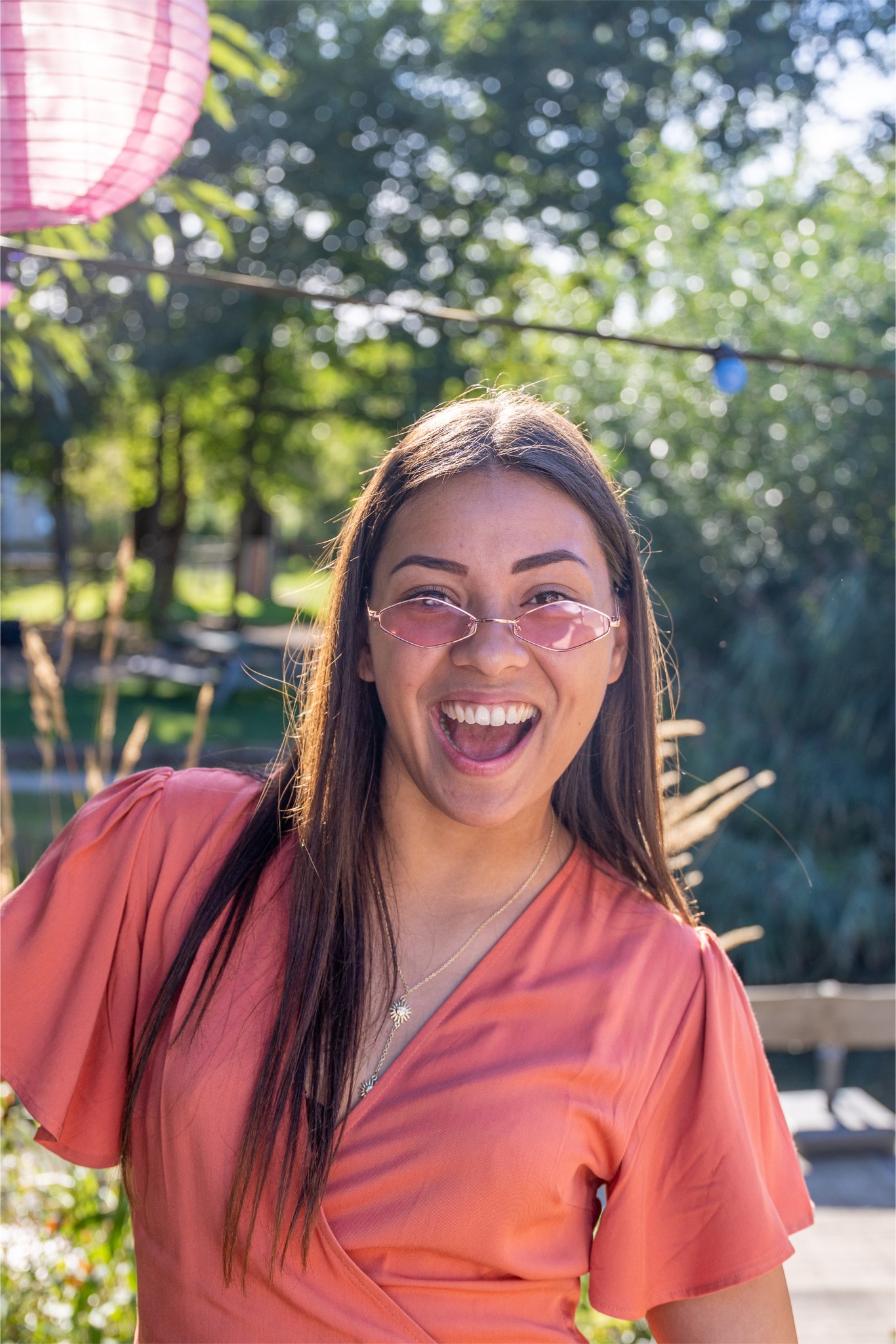 A woman and man climbing on a rock.