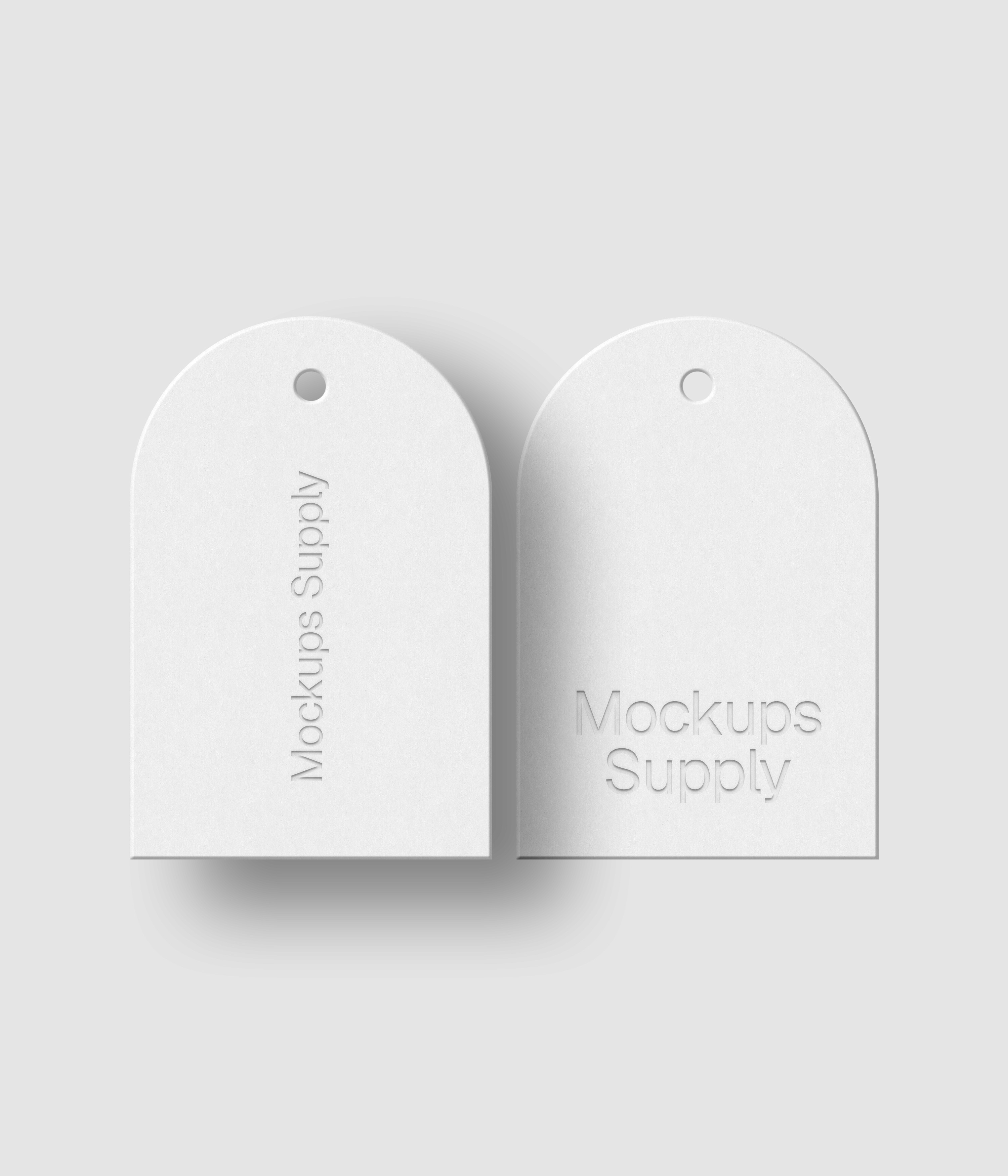 Arched shape clothing tag mockup with shadow overlay on Mockups Supply