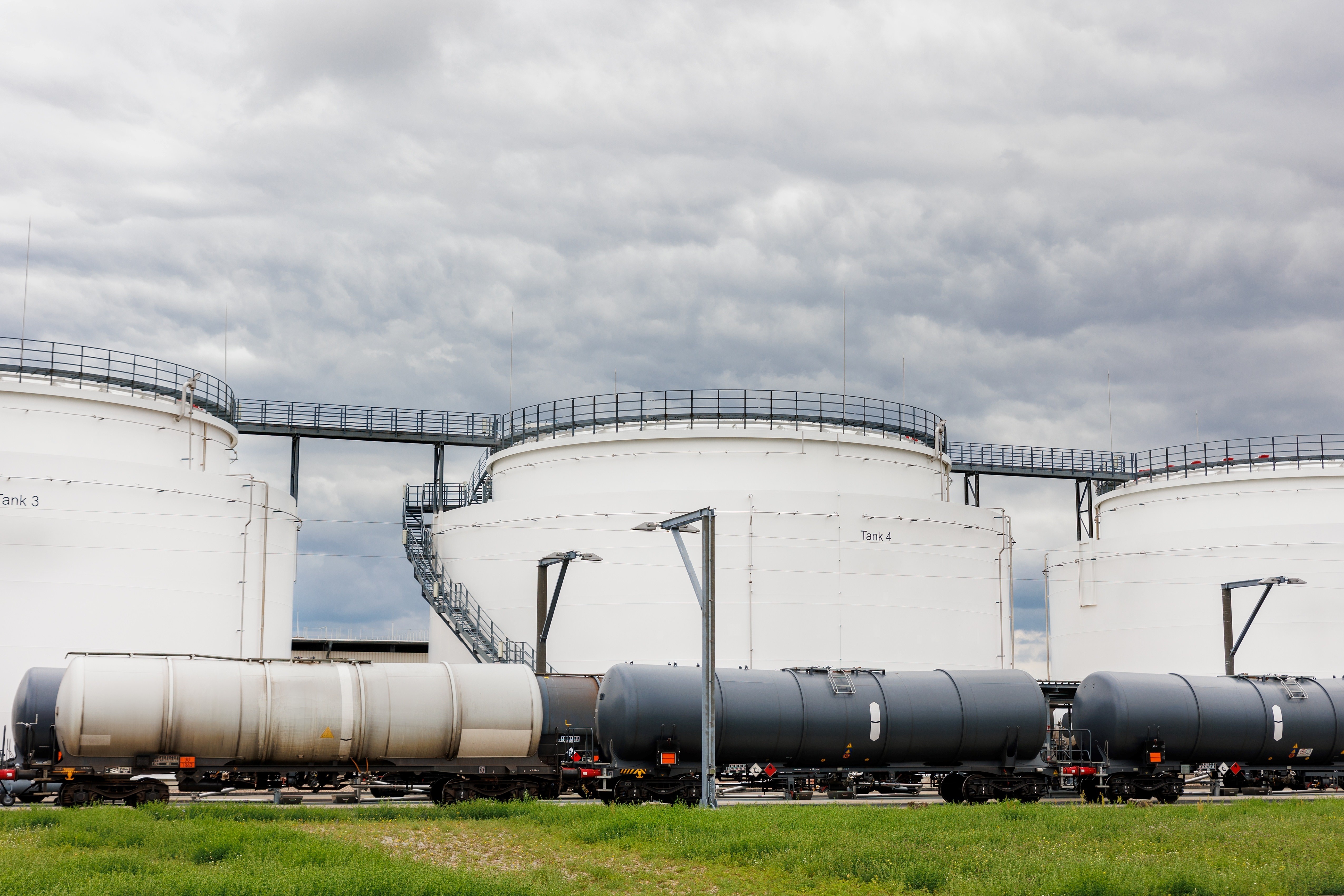 Transfer system connecting bulk storage tanks to distribution lines with pump control stations
