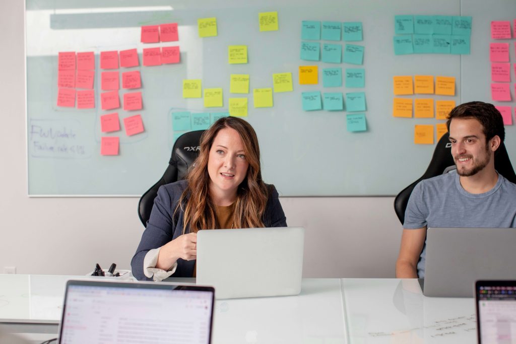 Collaboration between professionals analyzing results in a personnel selection test during a hiring process.