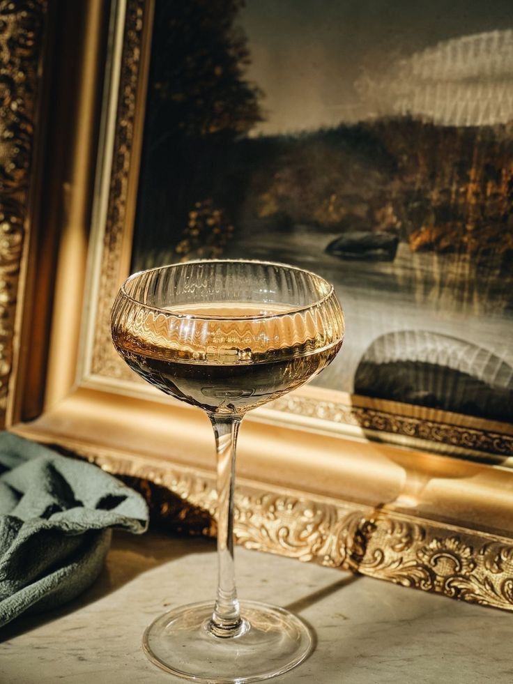 Luxury champagne coupe in an Old World setting, reflecting SNOOTI’s private wine membership and sommelier-led, elevated wine experiences.