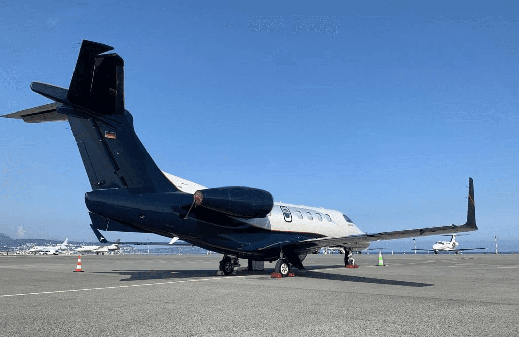 Helicopter and private jet on the runway