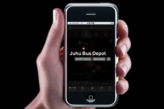 A hand holds a smartphone displaying the Juhu Bus Depot app. The screen shows route information including a red bus icon and route numbers 1 through 4. The time displayed is 4:20 PM. The app interface includes buttons labeled "REPORT TRAFFIC" and "KNOW MORE," along with a map view showing bus routes and stations. The bottom of the screen displays "4.2km / 75mins" and "SELECT." The phone has a black bezel and a silver home button.