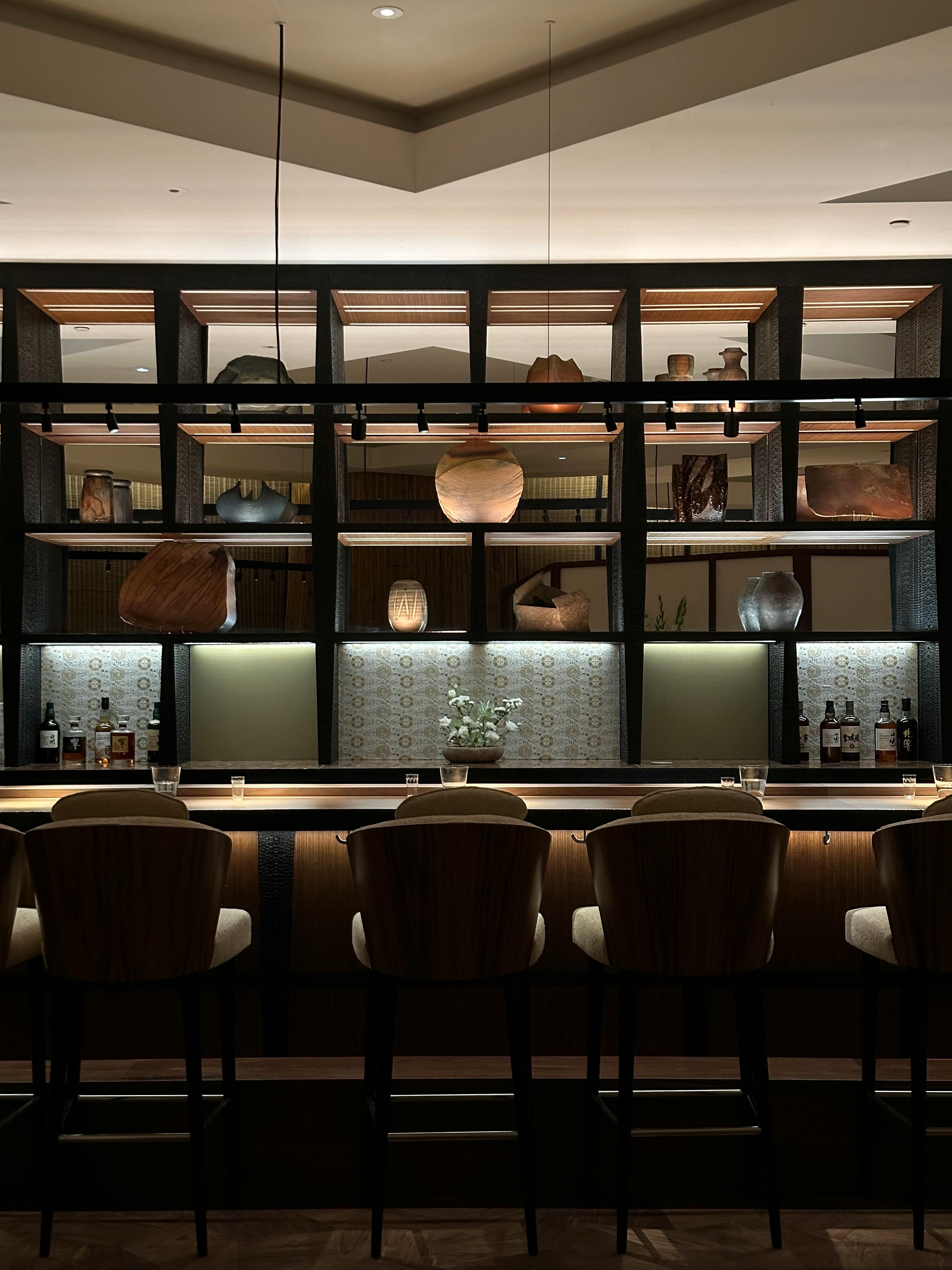 Two palm trees against a clear blue sky