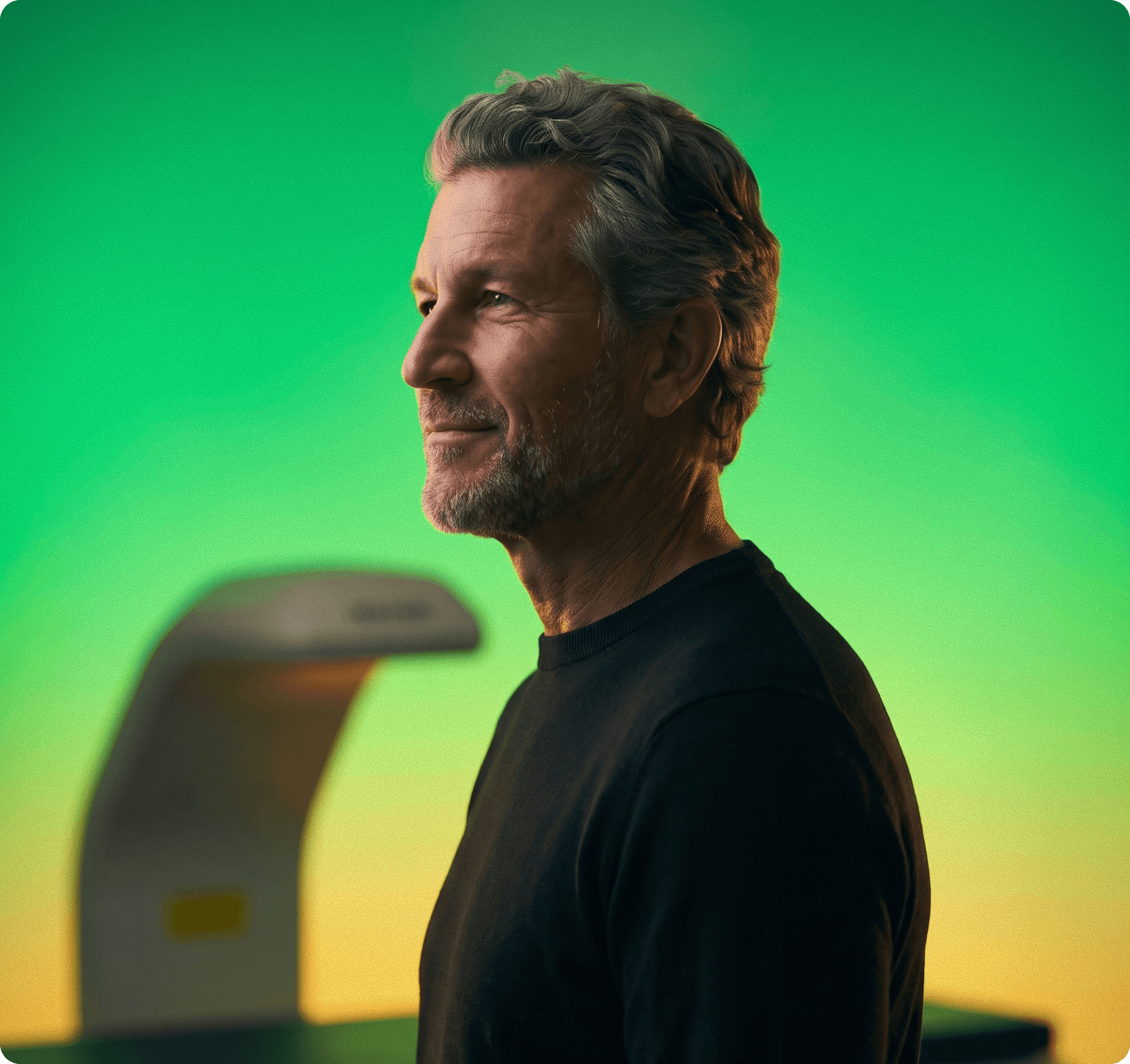 Man checking his watch, lit in green and yellow
