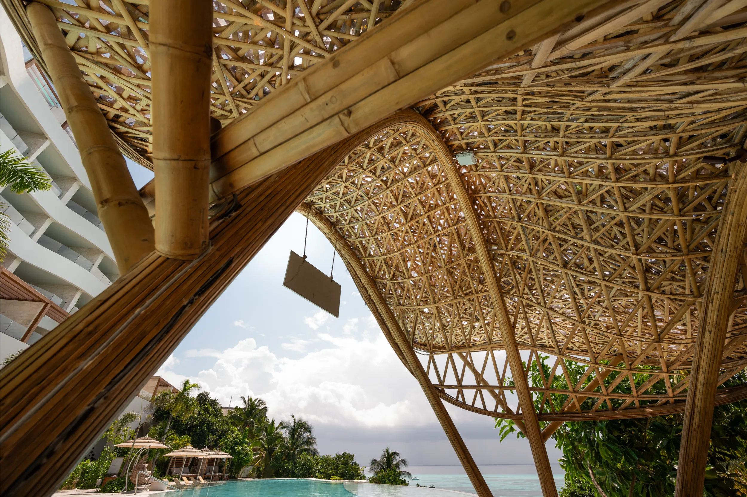 Interior perspective of the Hyatt Impressions bamboo wet bar, showcasing the complex structural weaving and bio-parametric design.