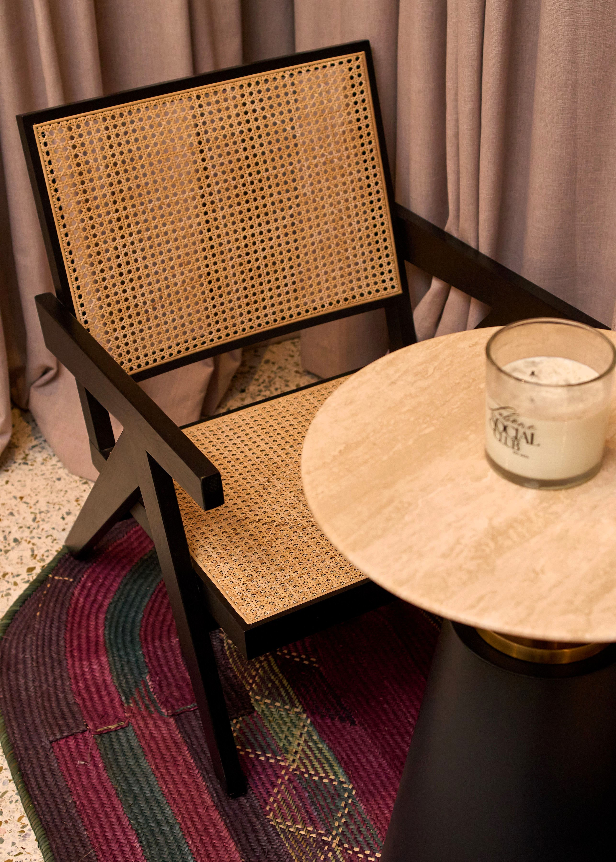 close shot of chair and table with candle