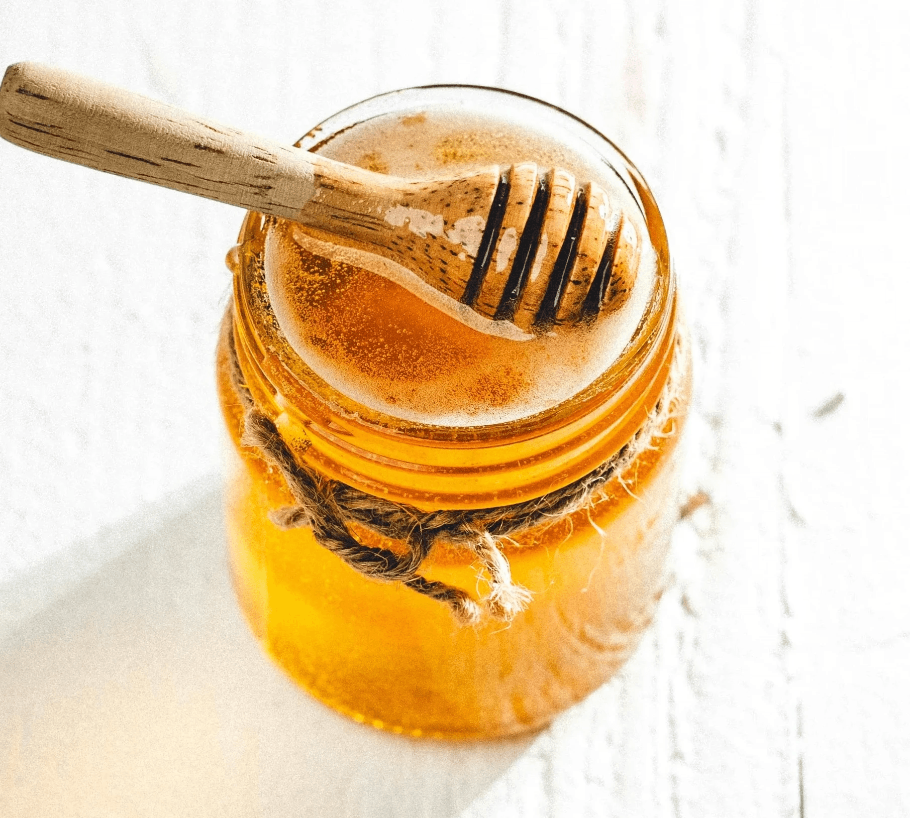 clear glass jar with brown liquid inside