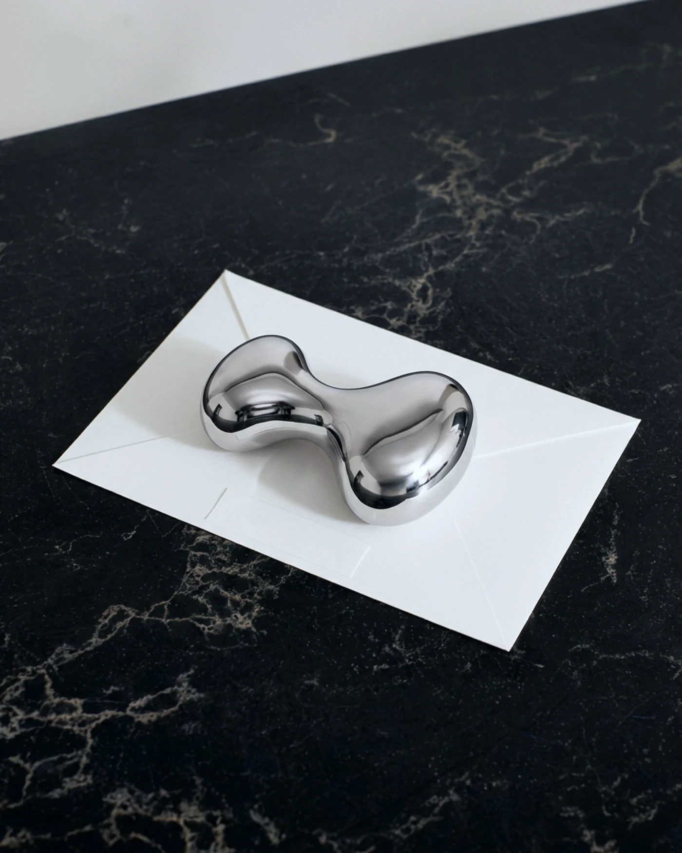 Hyperliquid Policy Center — liquid metal paperweight, brand identity by Charlota Blunarova