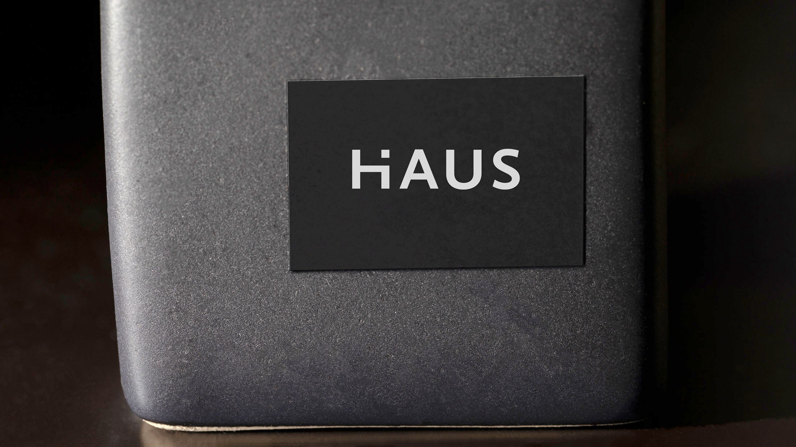 Nuevo Haus logo label on a dark grey box
