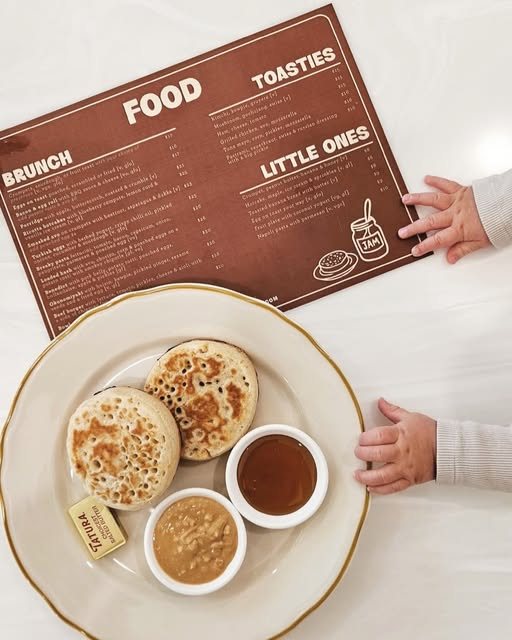Crumpet food menu beside a plate of crumpets