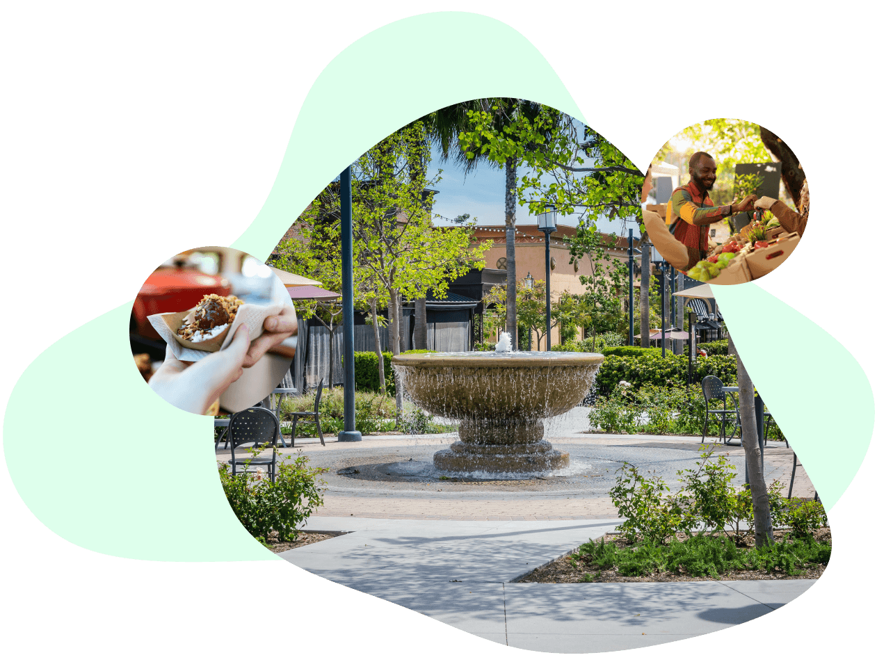 Public plaza with a fountain and people enjoying food