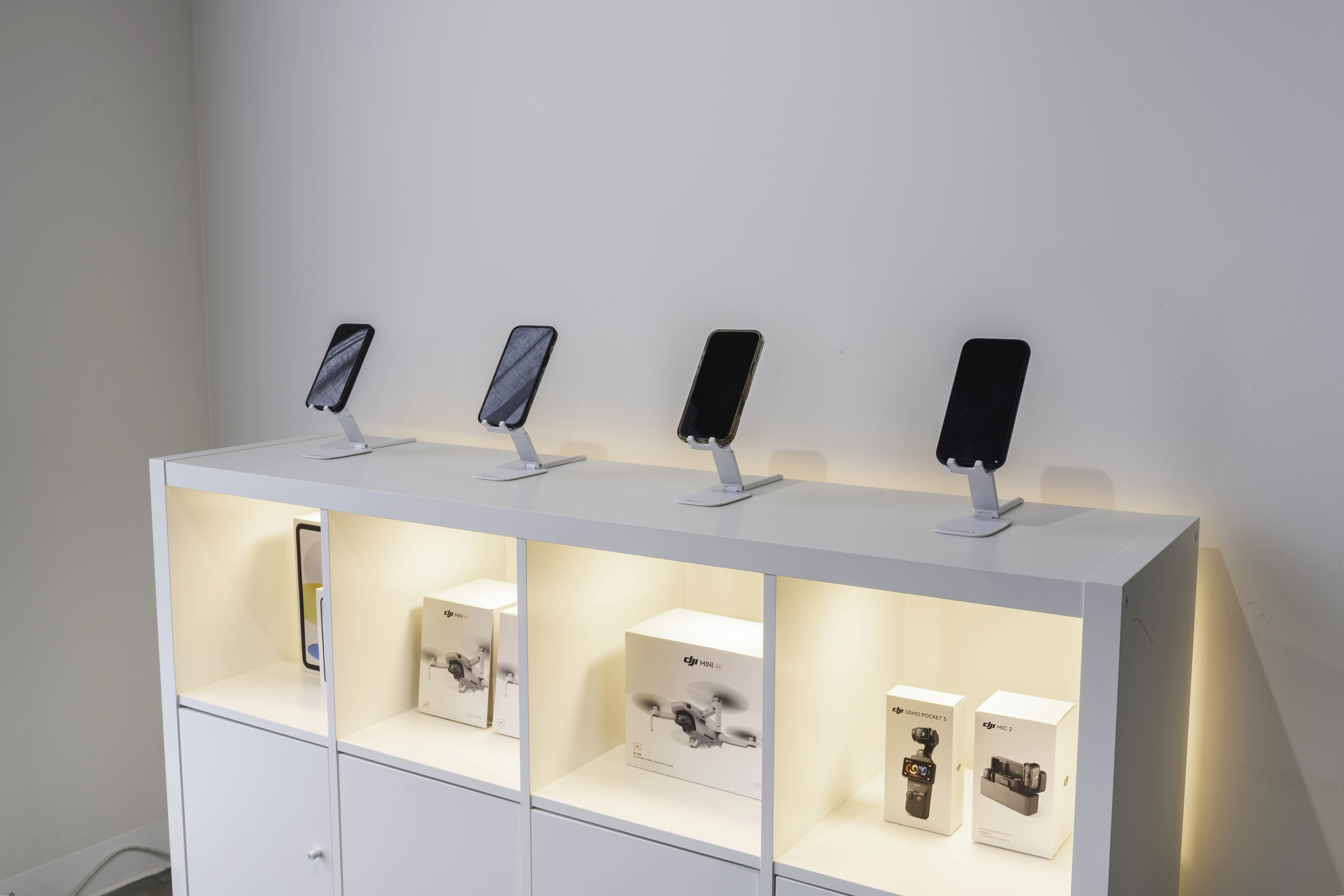 Hands working on a device or document, representing professional results delivered to clients.