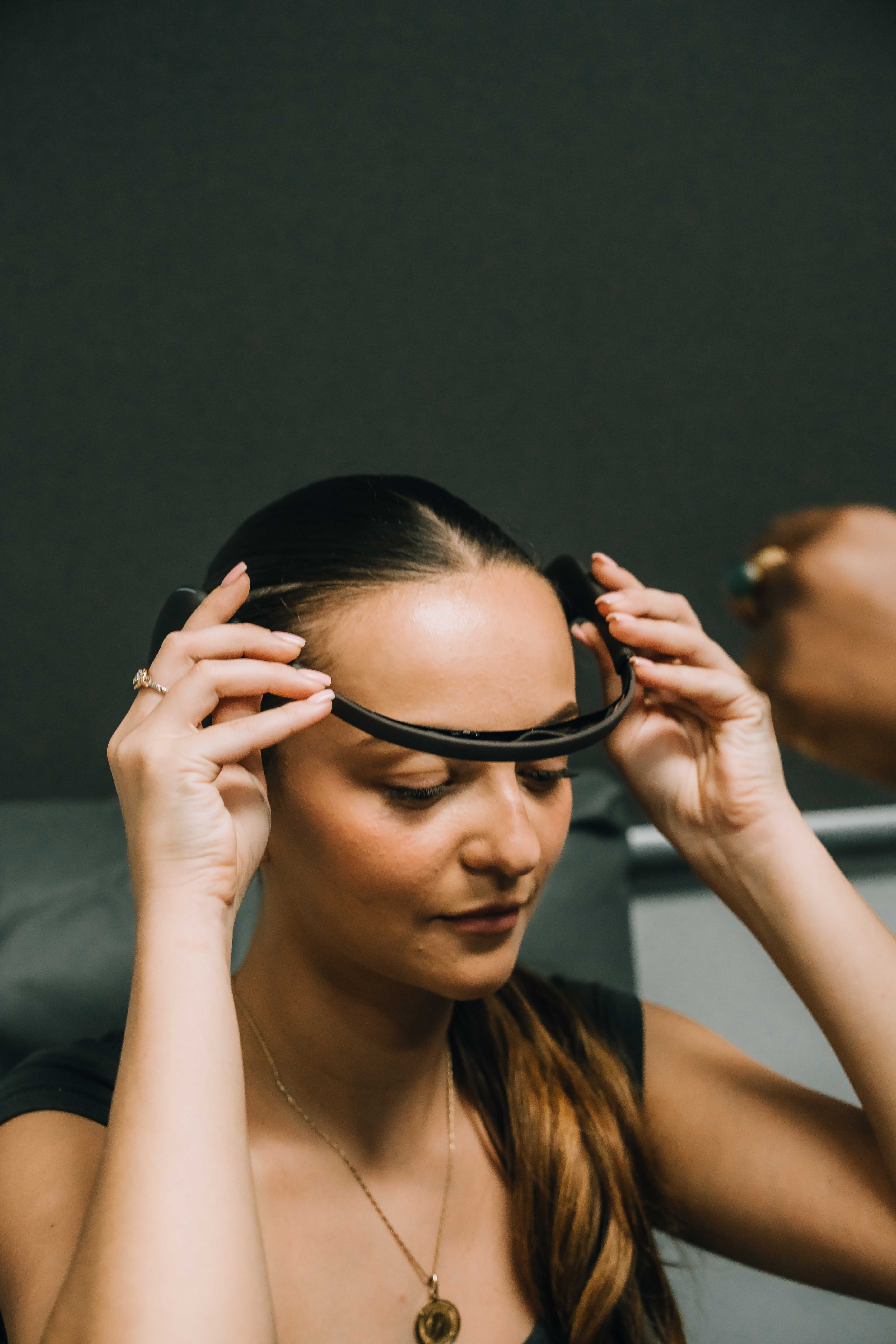 three men and one woman laughing during daytime