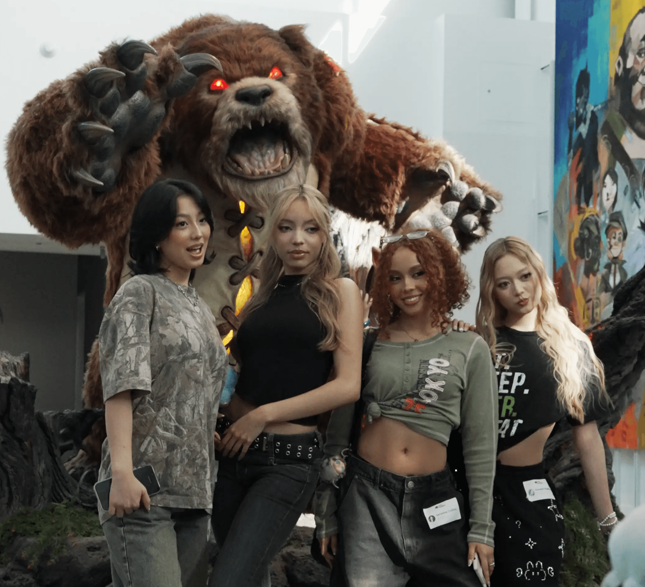 GIRLSET posing for a photo with a statue of Tibbers from League of Legends