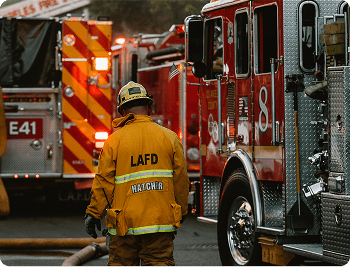 two people looking at a tablet and smiling