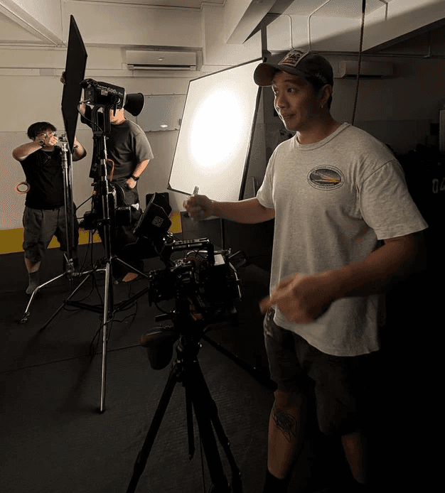 silhouette photography of man holding camera