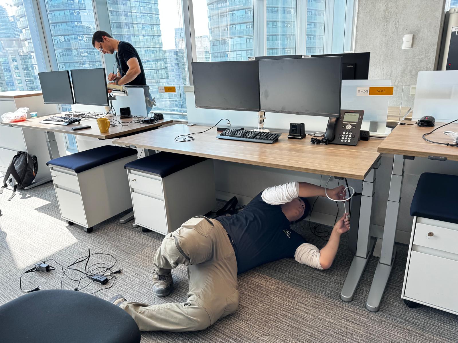 Unio technician labeling server cables before an office relocation