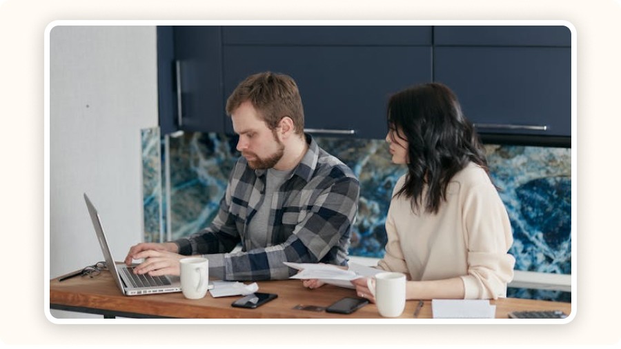 Two professionals analyzing financial documents