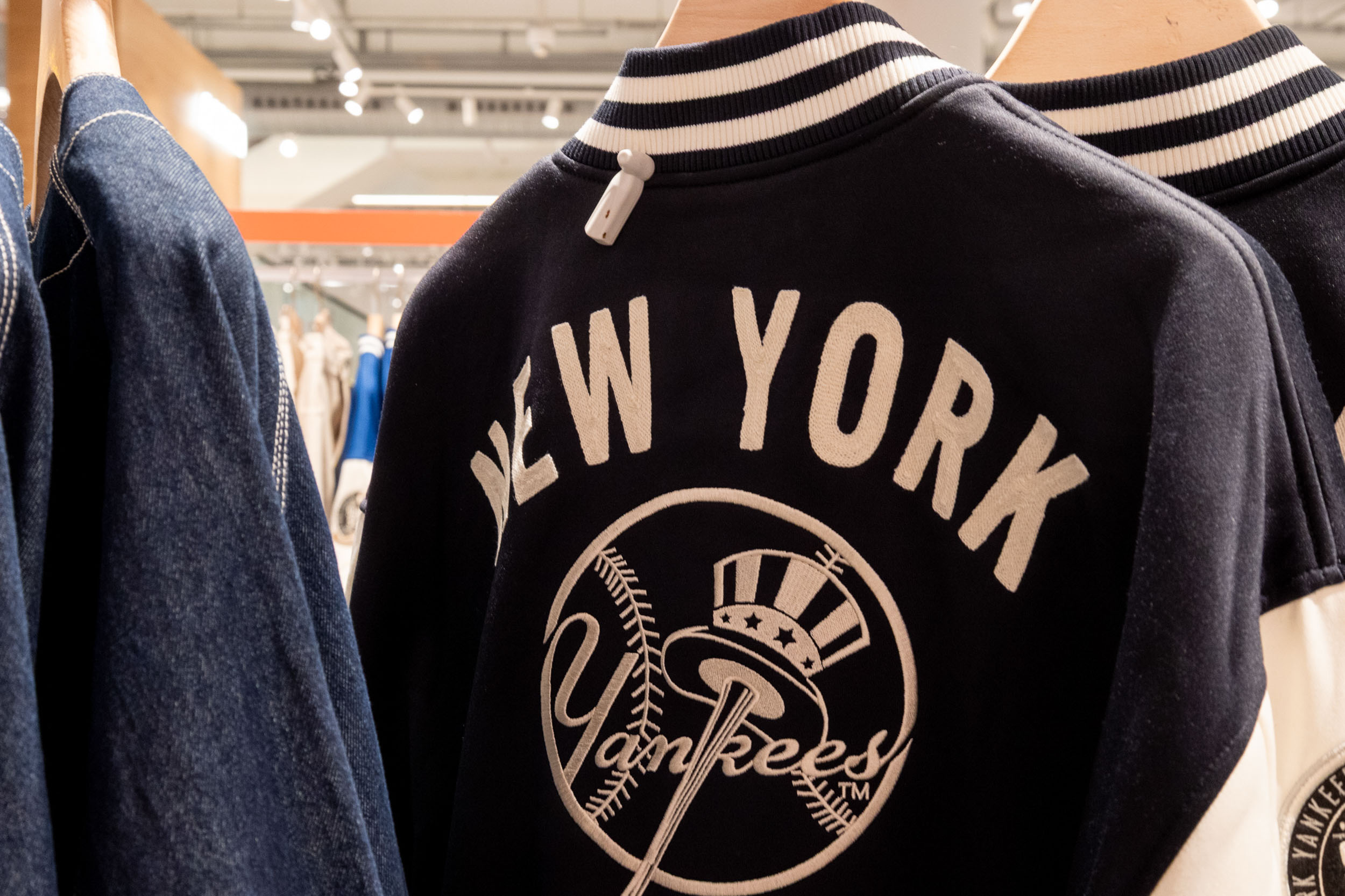 Sports apparel display featuring branded clothing, themed merchandising