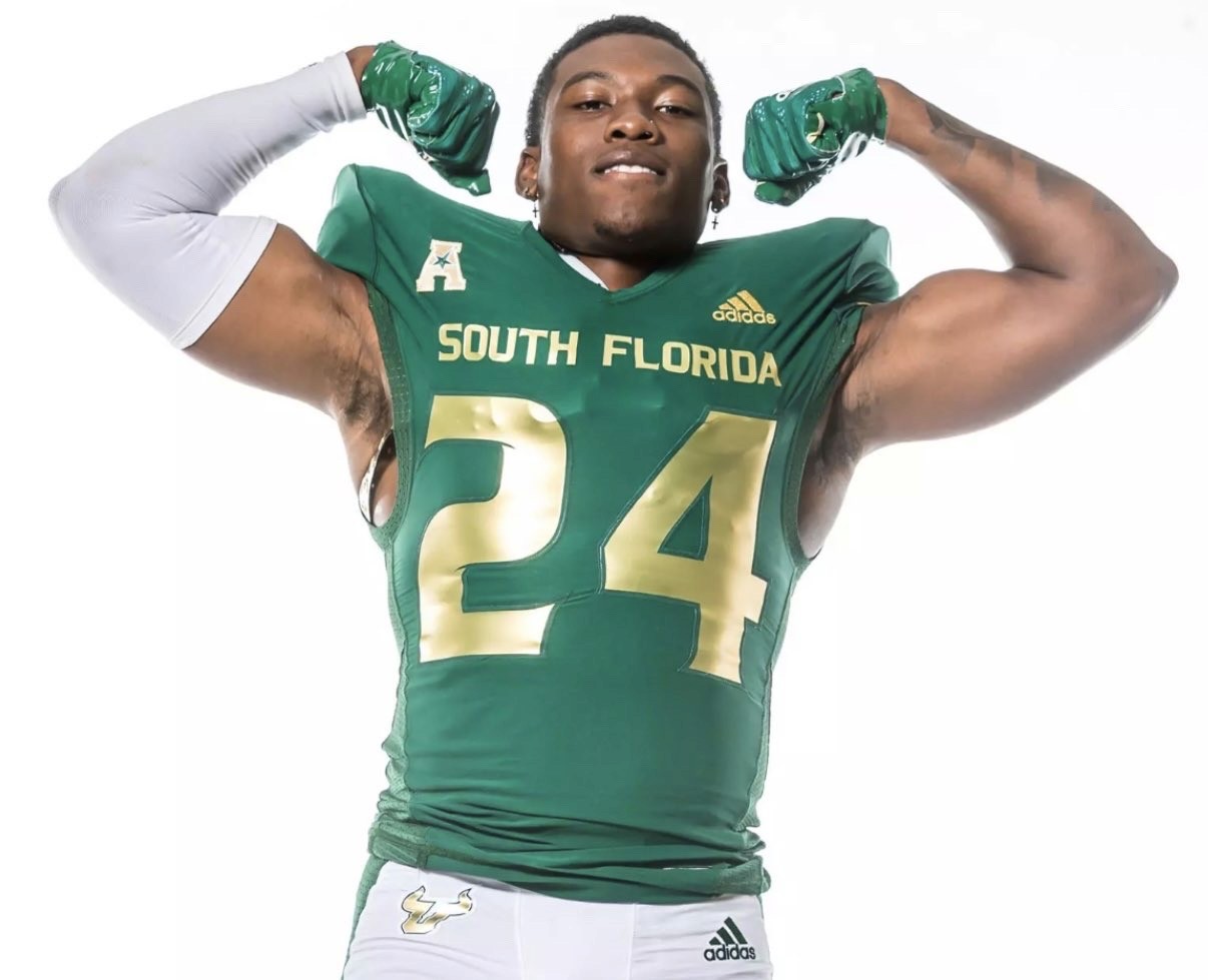 Sara is a client smiling to the camera happily