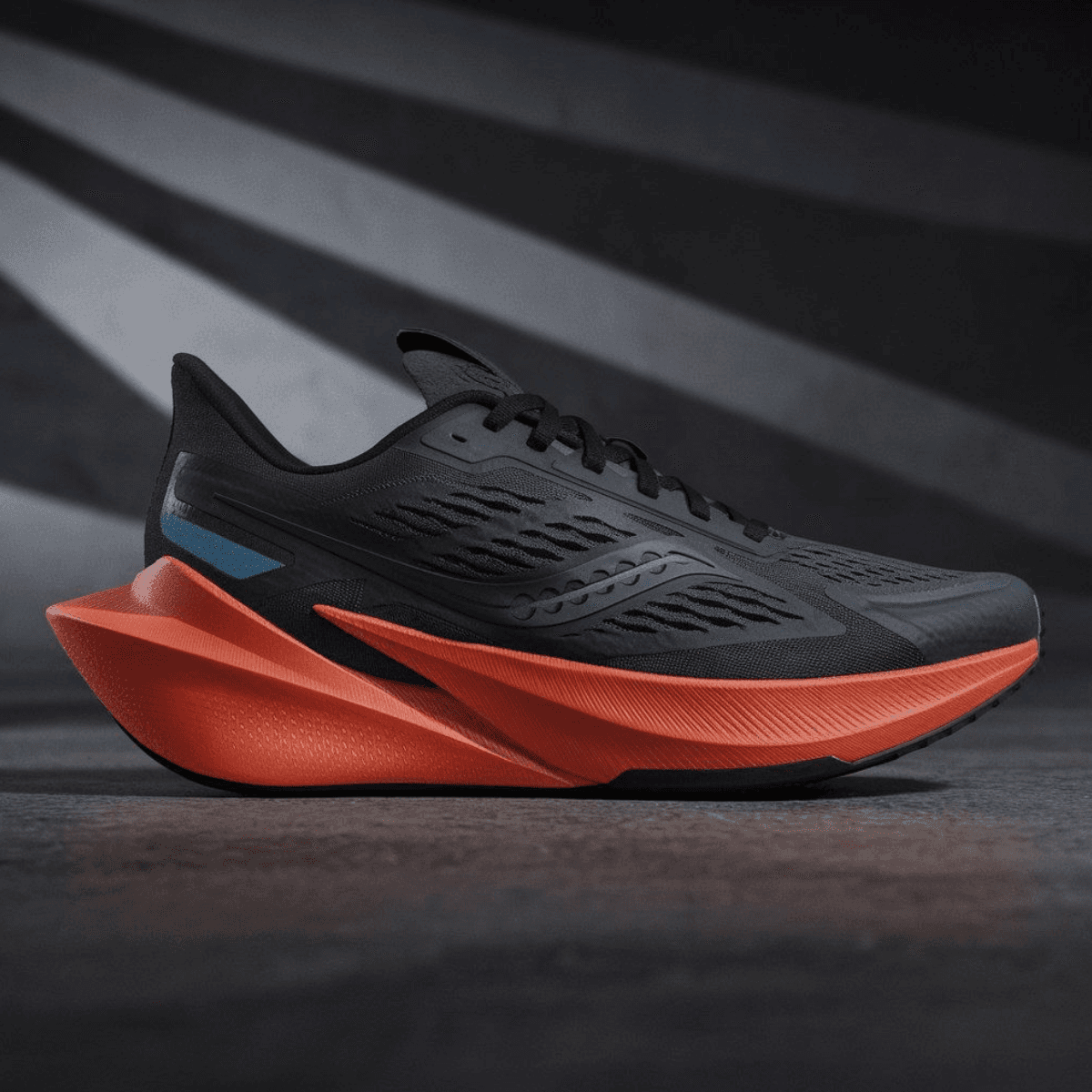 Black Velocity One Corbell men's sneaker with orange sculpted sole and mesh upper.
