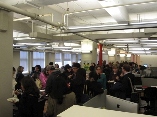 A group of people sitting in an event room and serving a Swedish bouffe.