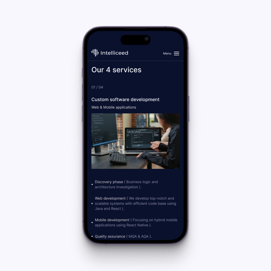 Modern home office setup with a monitor, ergonomic chair, keyboard, and indoor plants near a window with blinds.
