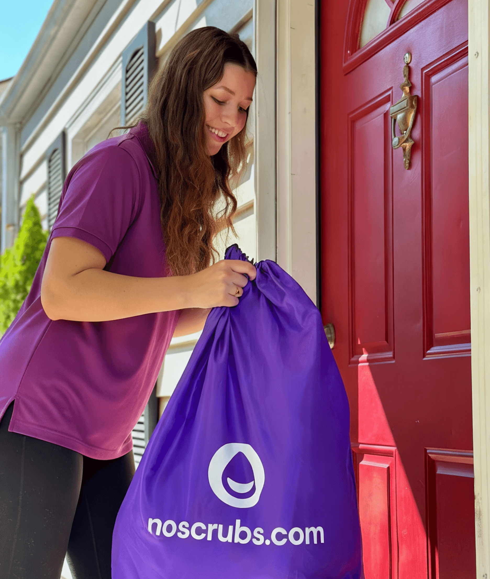 A NoScrubs Scrubber picking up a laundry bag from the doorstep.