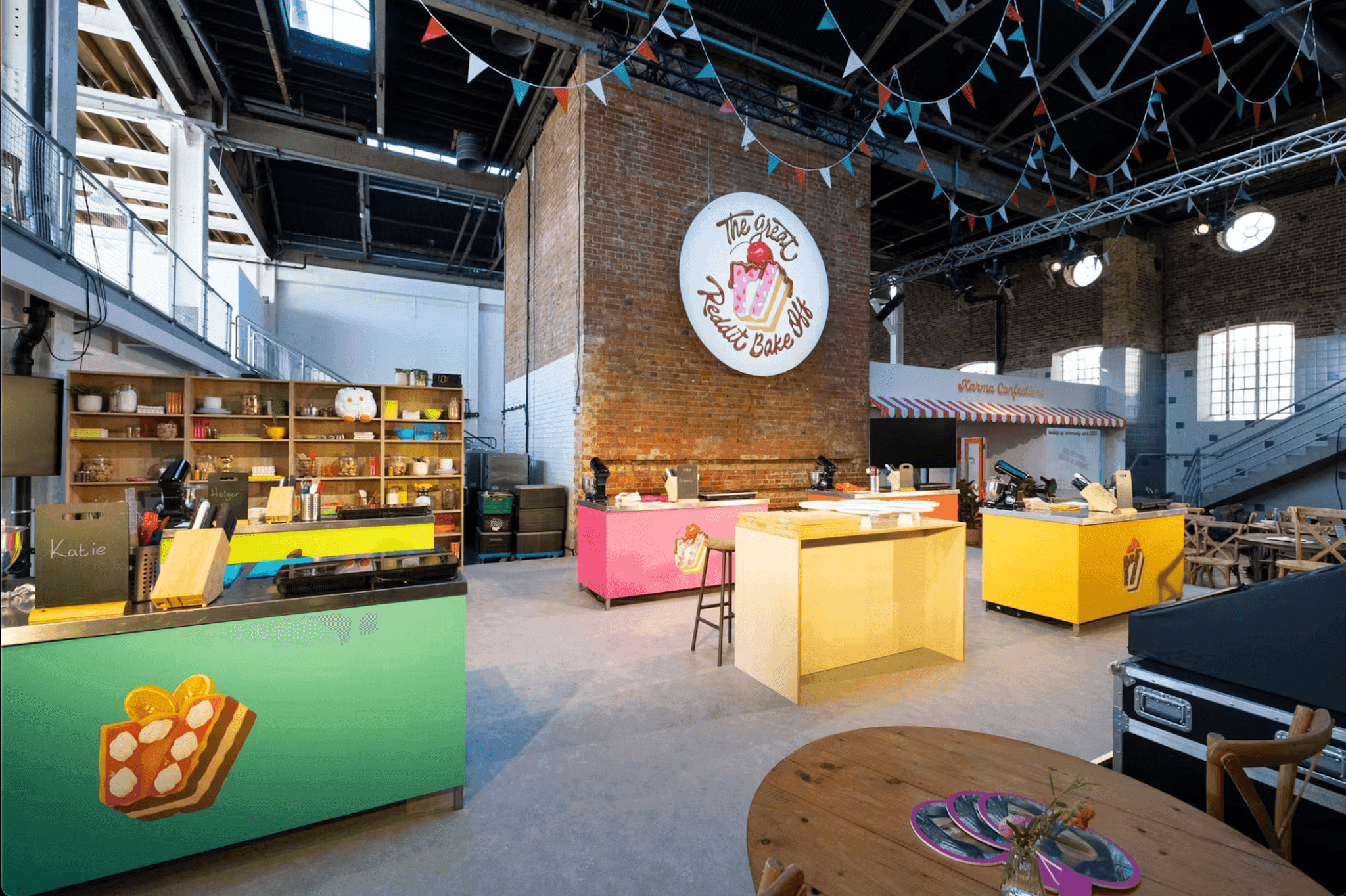 A BBC news studio setup featuring a central desk, bright lighting, and large screens in the background.