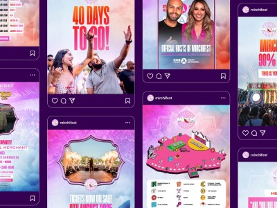 man wearing grey t-shirt standing in front of man sitting on chair