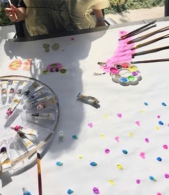 Nanny Anne is going to paint with her babysitters.