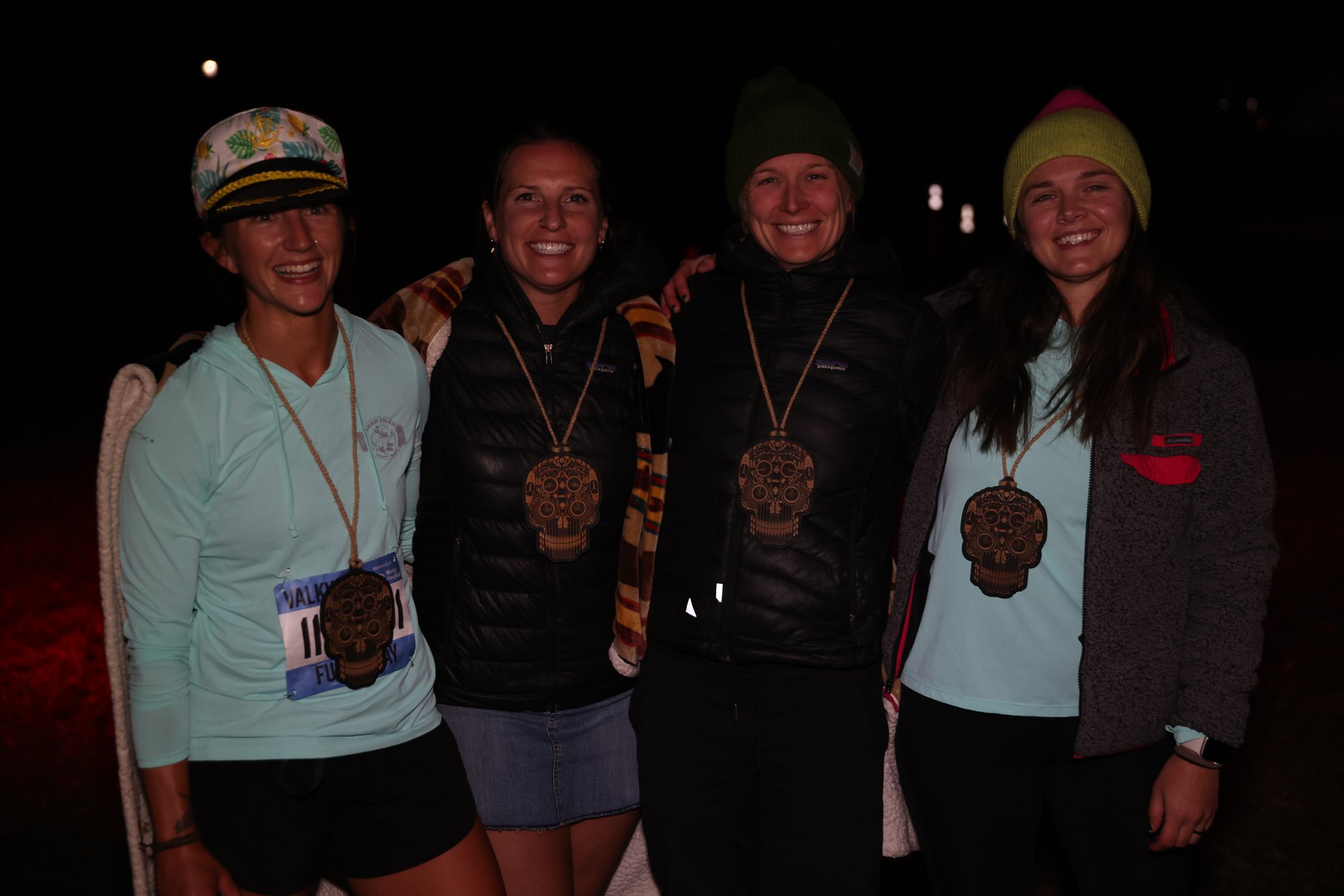 Racers and crew at the venue after dark