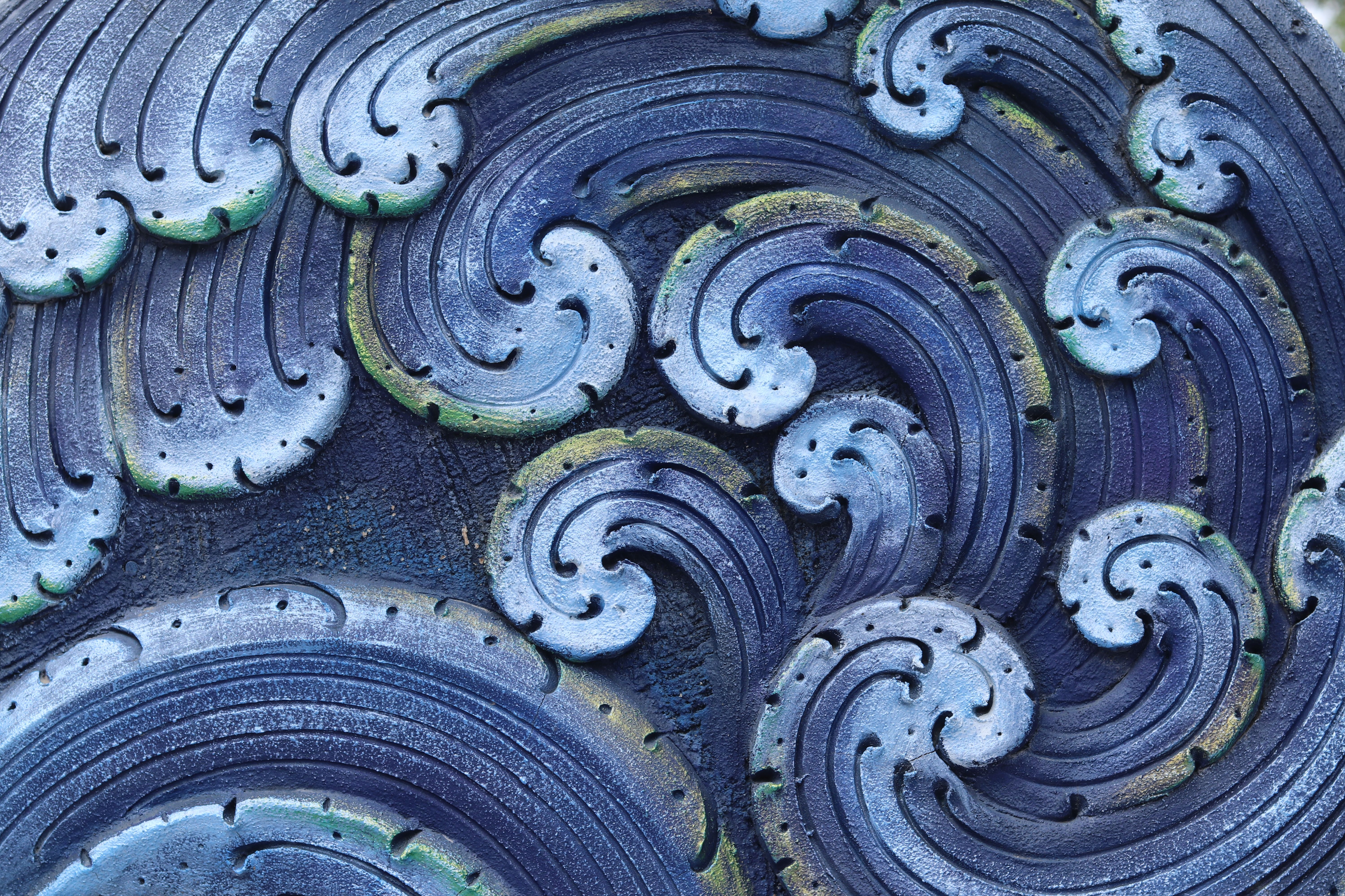 Abstract gradient waves of blue, purple, and pink.