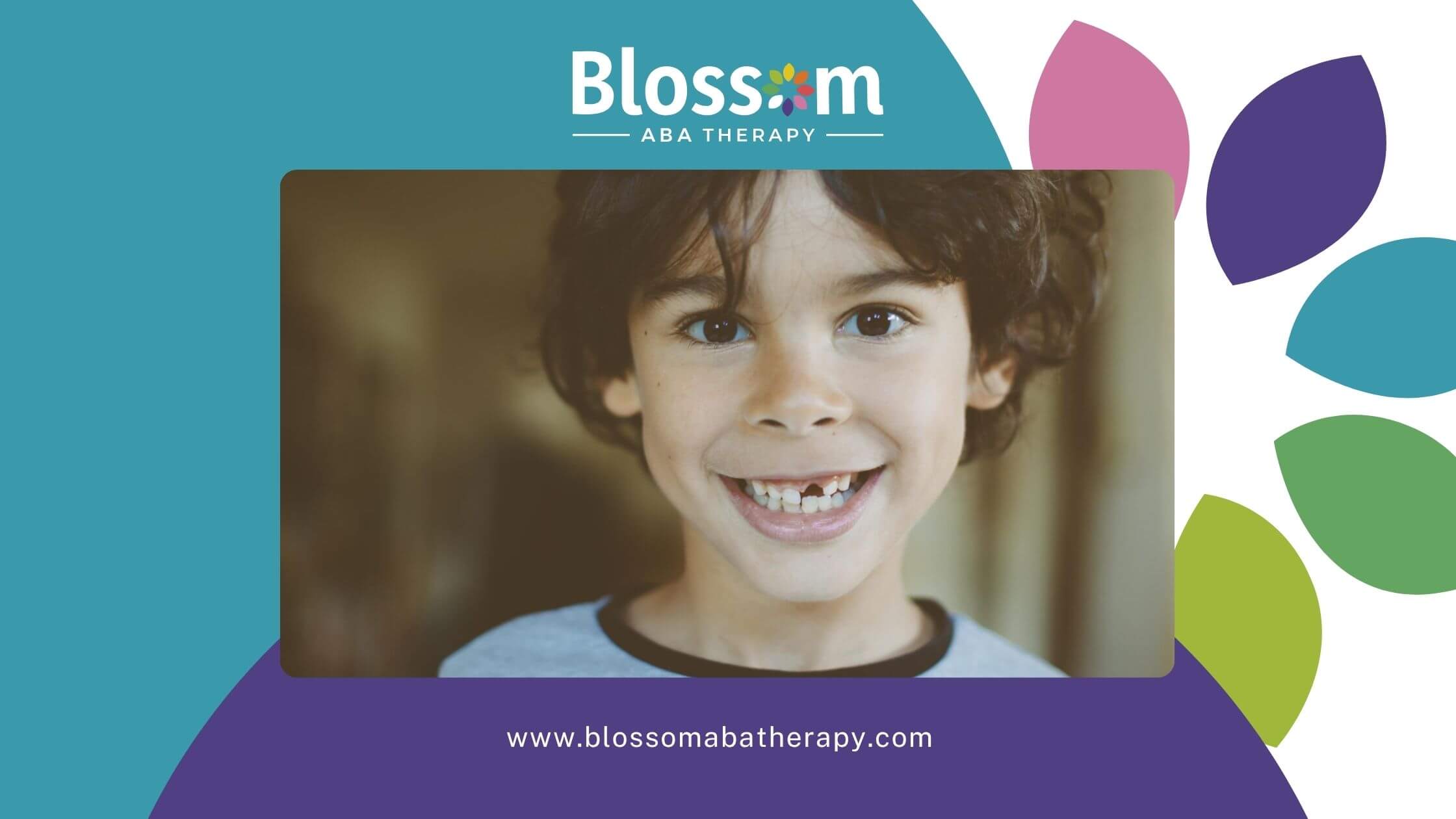 Smiling young boy with autism showing missing tooth indoors.