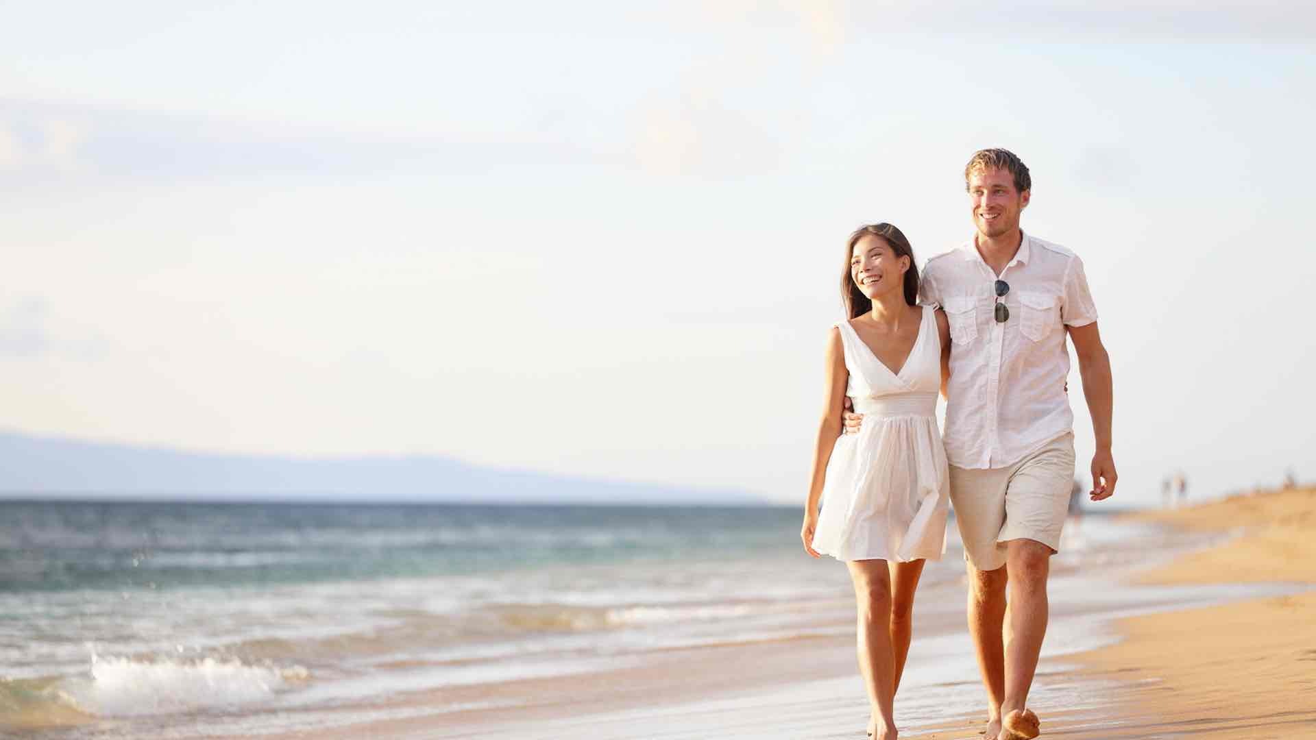 couple walking on the beach side
