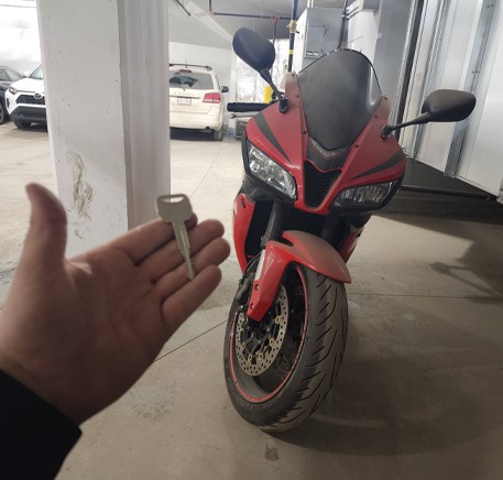 Freshly cut motorcycle key made on-site by CarKeyAction in Calgary.