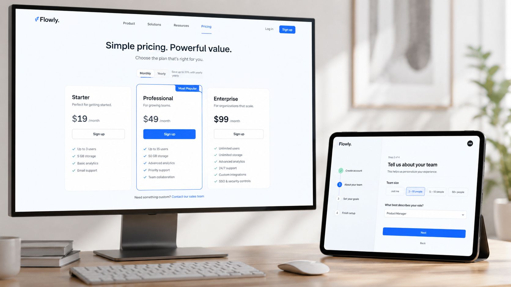 A desktop monitor and tablet displaying a SaaS website design with pricing tiers and user onboarding forms.