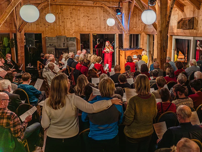Large group of people singing together