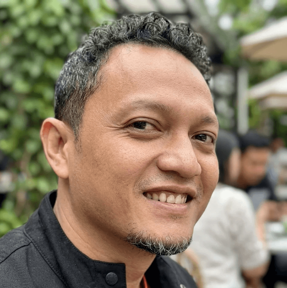 woman in black long sleeve shirt sitting on white couch