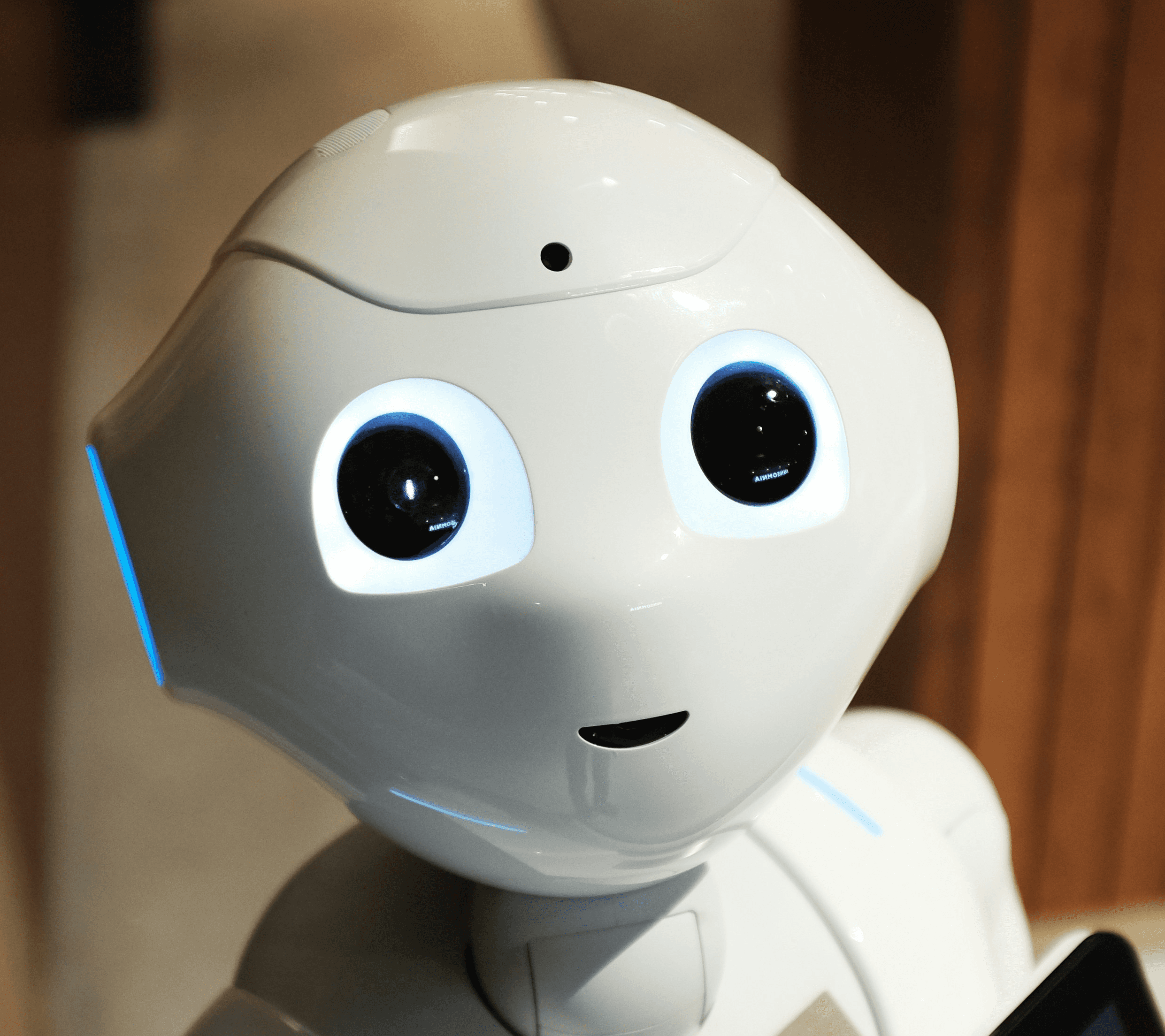 white robot near brown wall