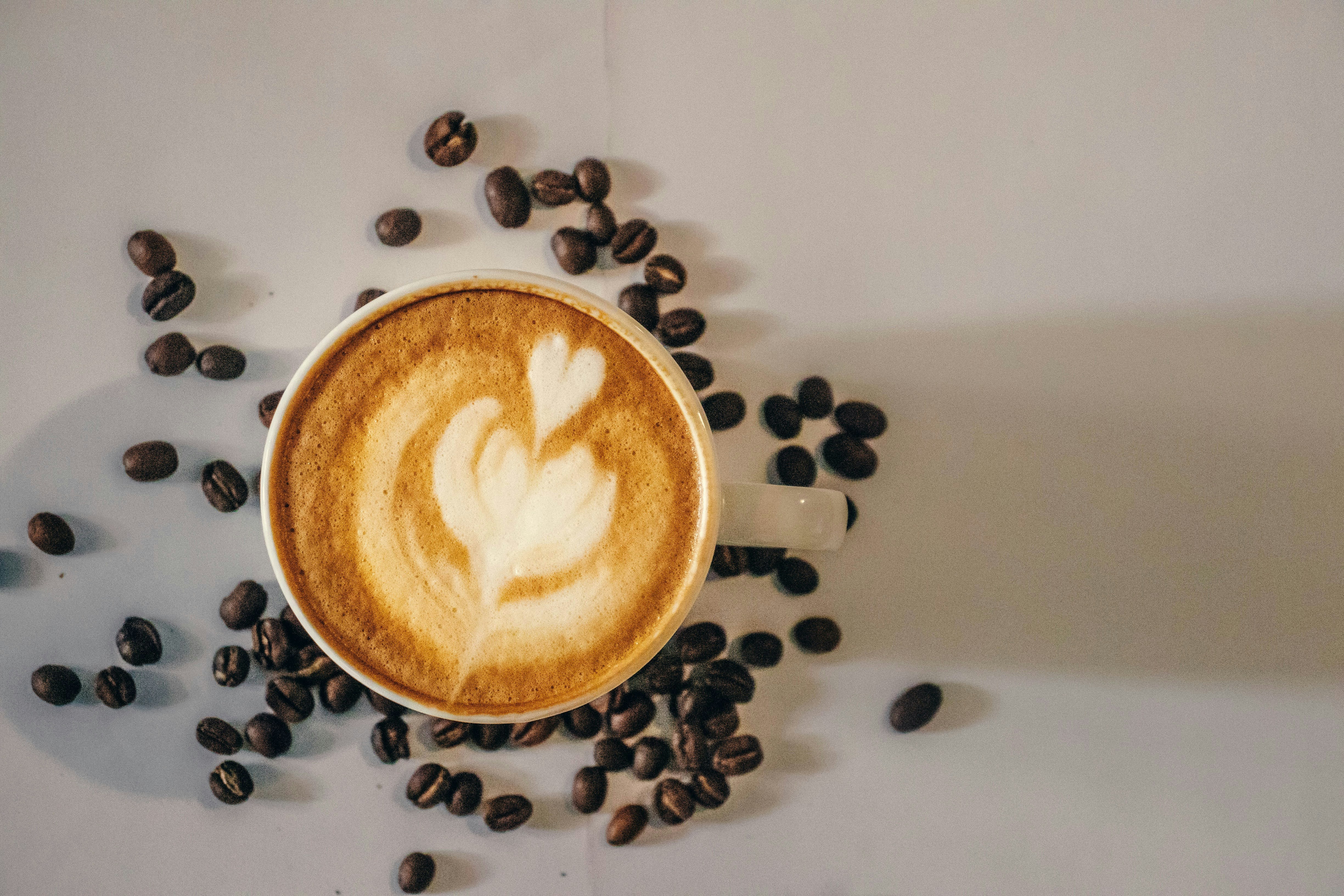 white ceramic mug with coffee