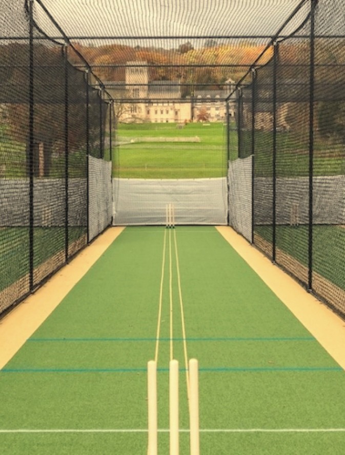 Two batsman standing side by side