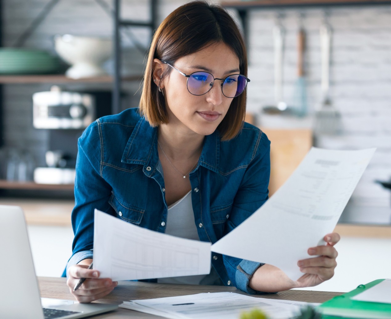 a cellphone leaning against a wall