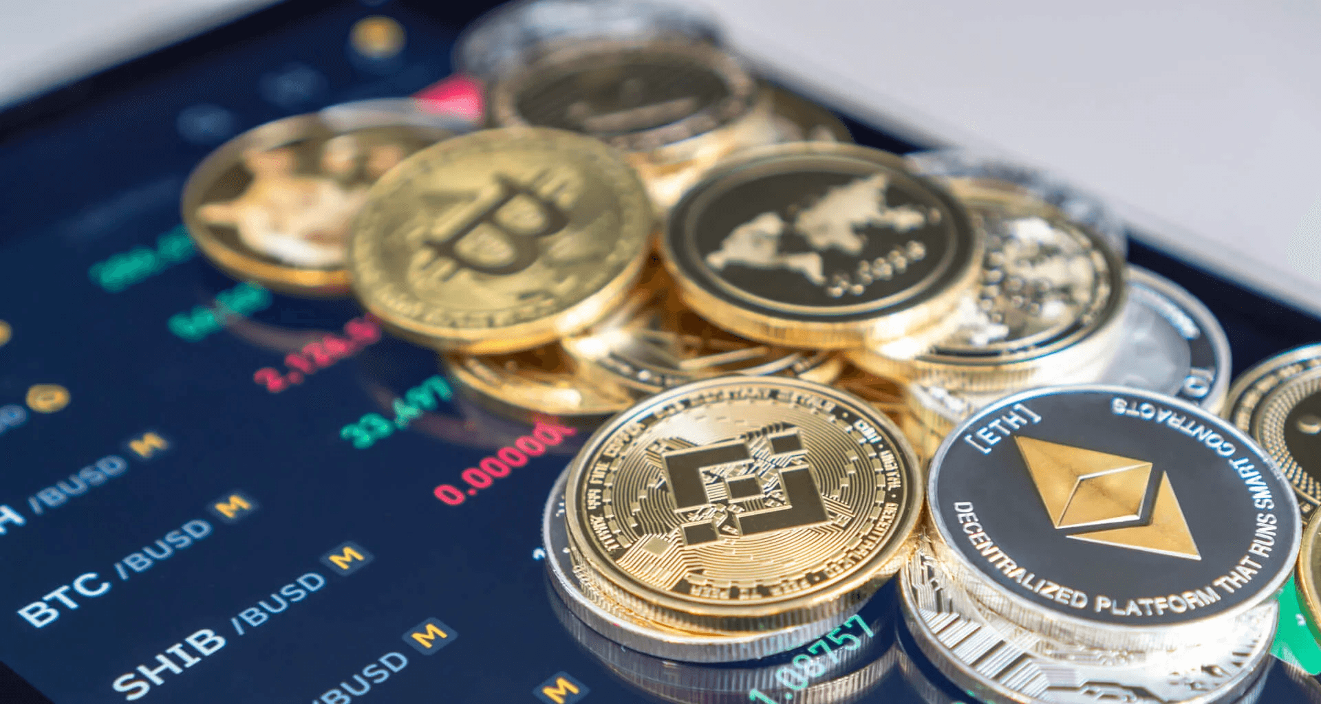  Physical cryptocurrency coins on trading screen -  Best Crypto Pairs to Trade Today