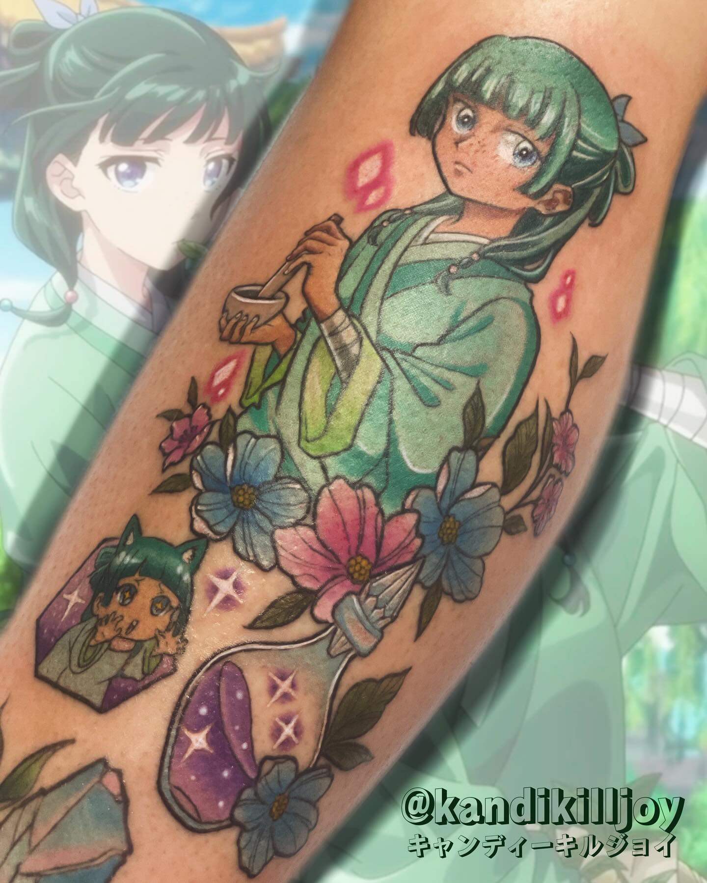 A vibrant tattoo of a chainsaw-like creature on a person's forearm. The tattoo is detailed with shades of orange, black, teal, and red.
