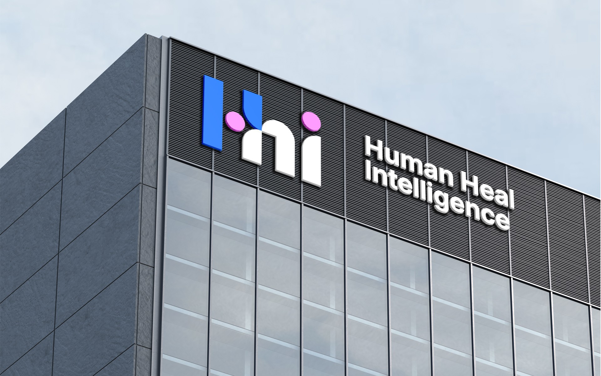 Exterior signage of Human Health Intelligence on a building facade