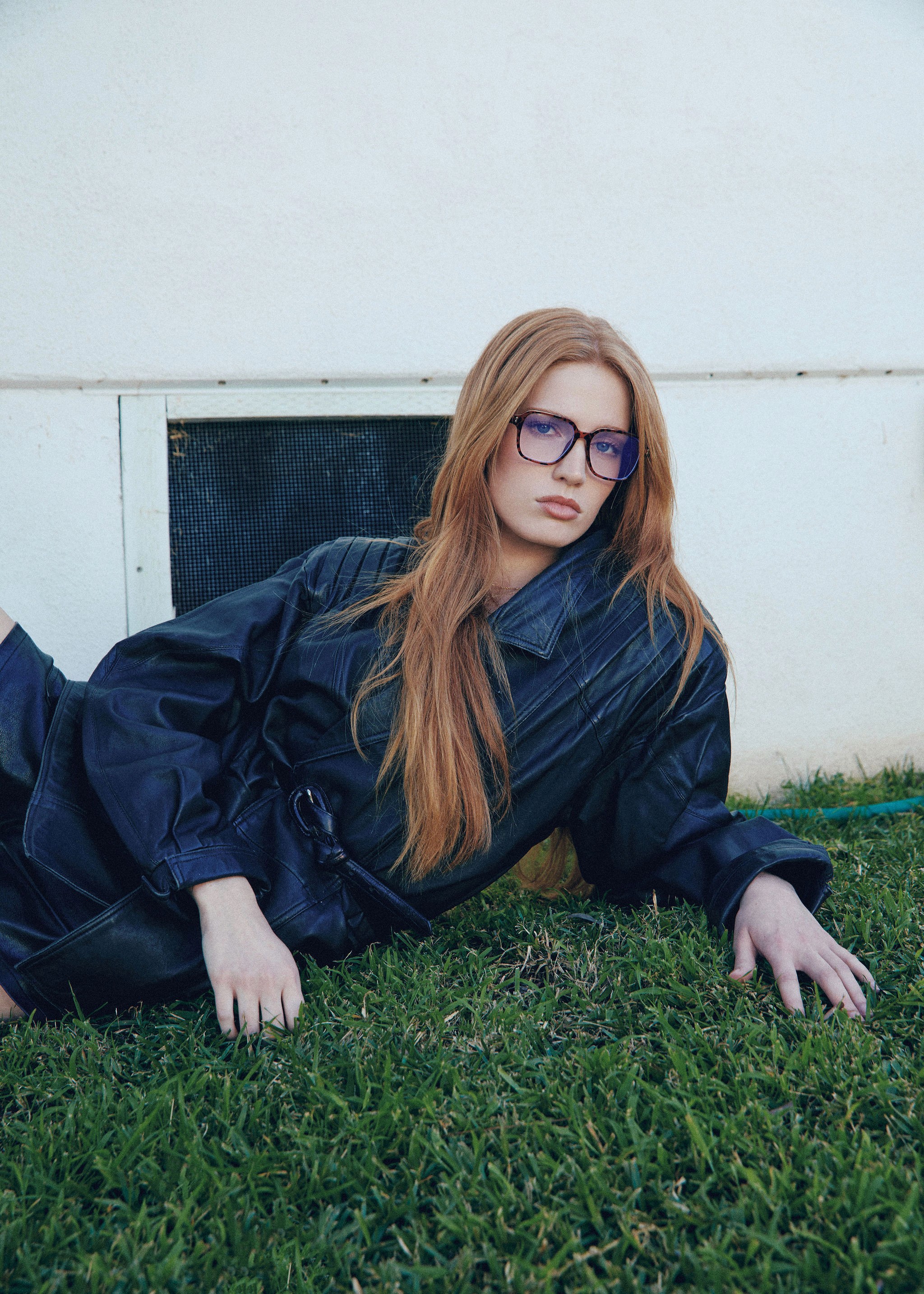 A tall waterfall cascades into a turquoise pool below.