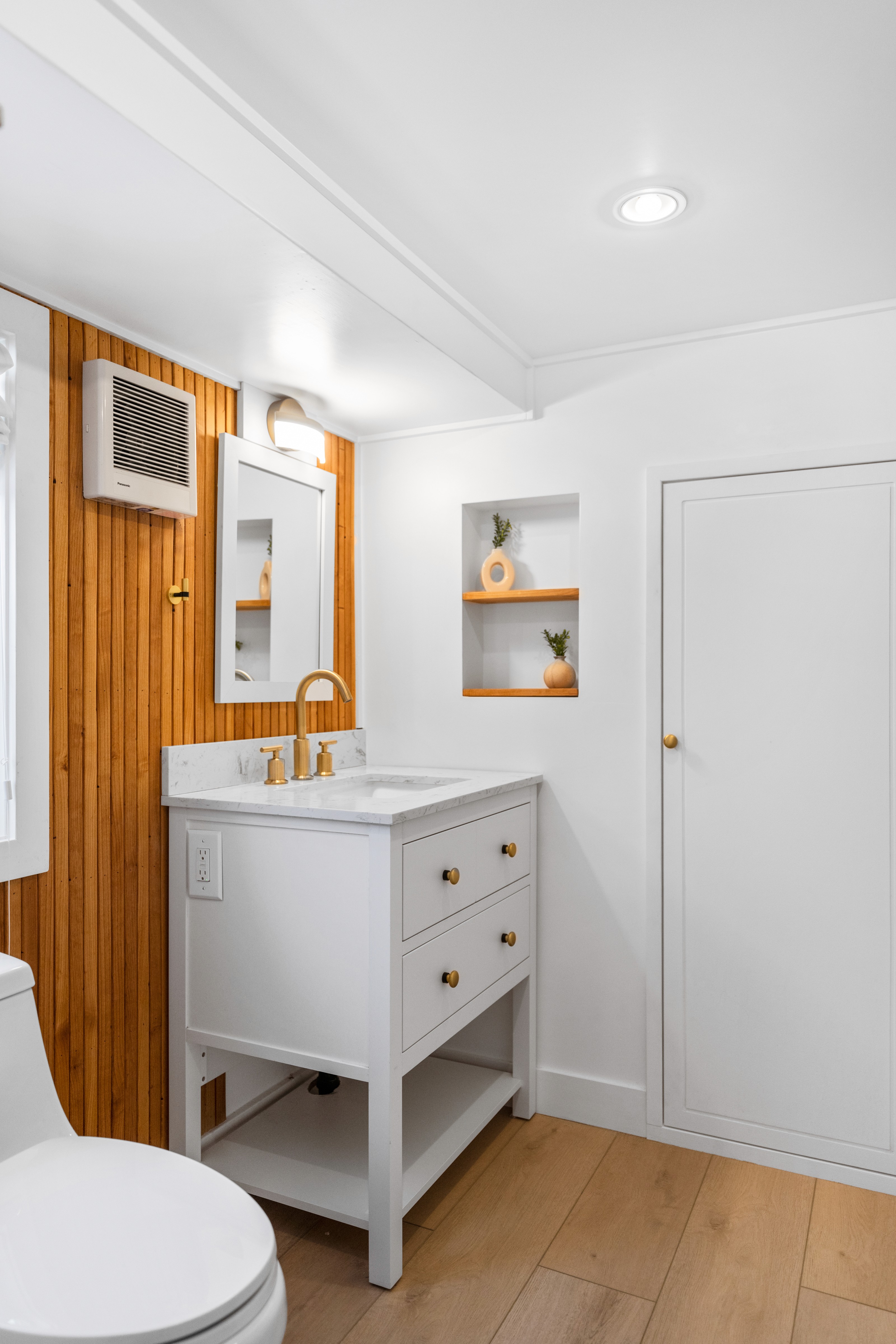 St. George Utah kitchen remodel showing oven with natural wood hood and green cabinetry